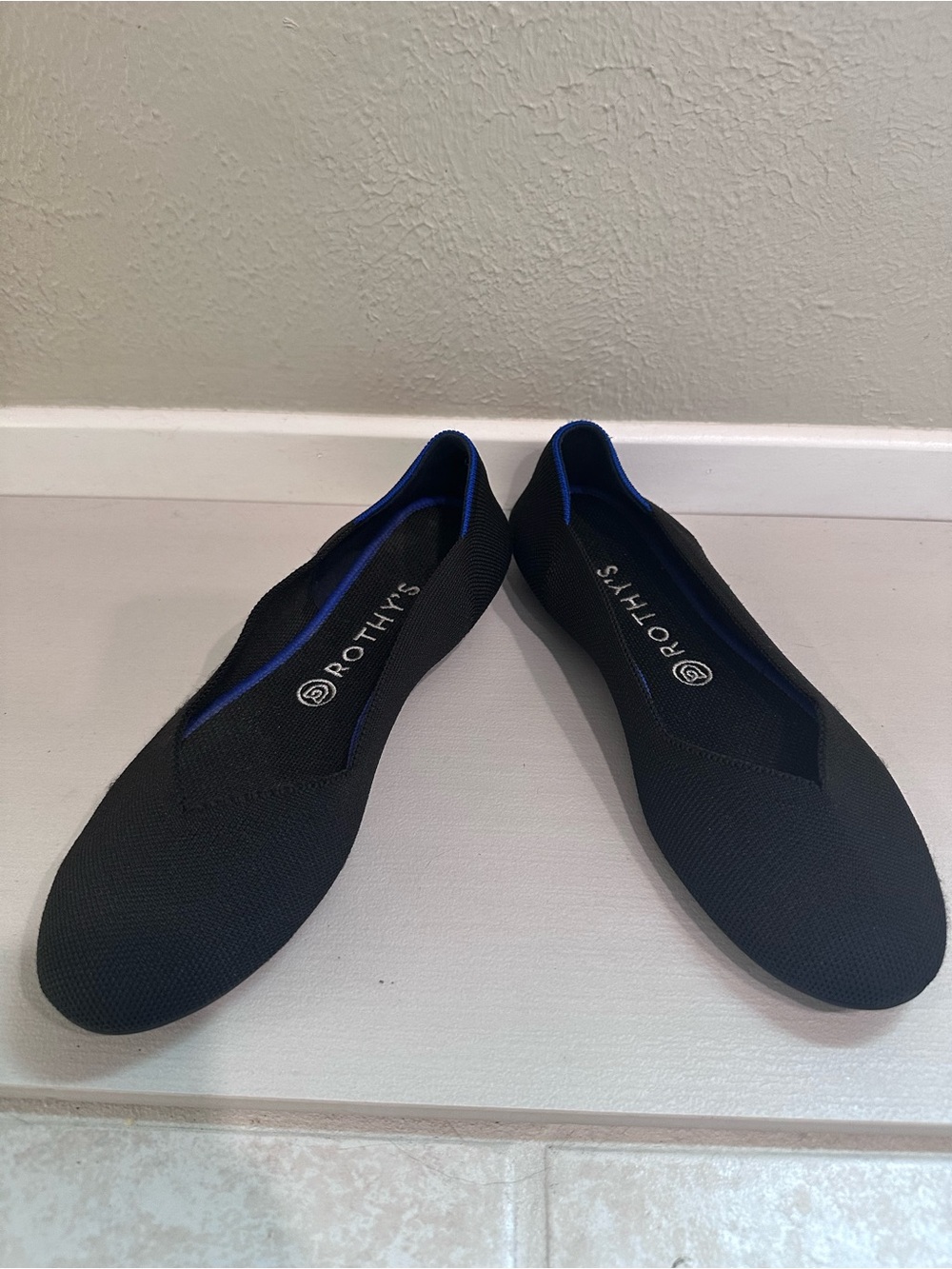 Rothy's Black Flats with Blue Trim